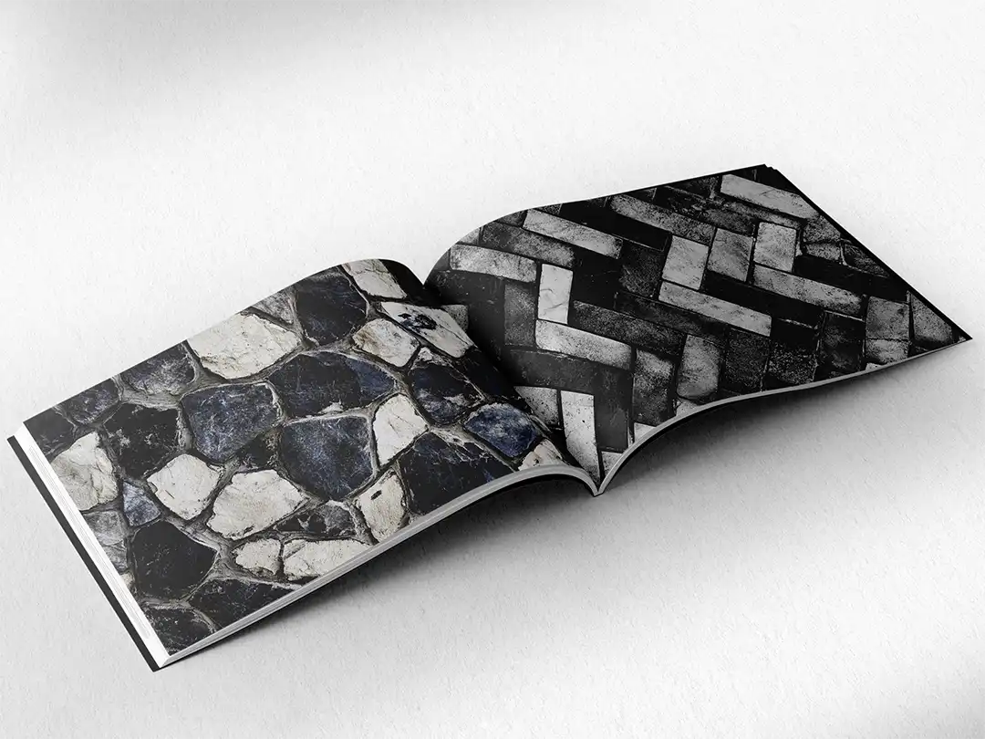 open book showing the inside pages of the decorative stone textures prints pad. The picture inside the book is a black and white stone texture