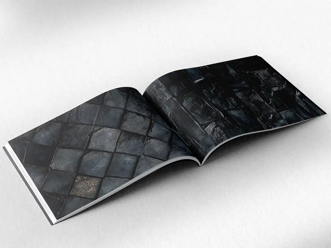 open book showing the inside pages of the decorative stone textures prints pad. The picture inside the book is a black stone texture