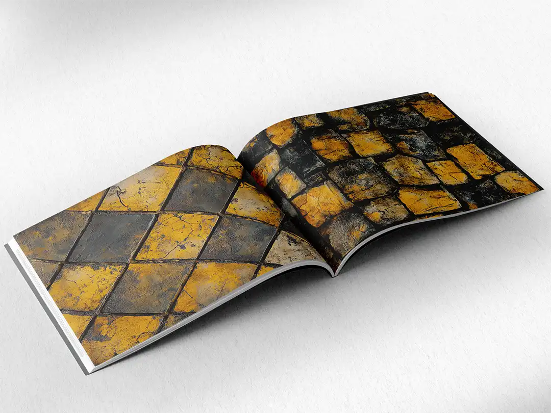 open book showing the inside pages of the decorative stone textures prints pad. The picture inside the book is a yellow stone texture