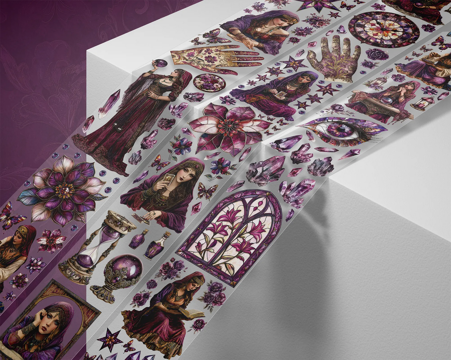 A roll of decorative PET tape stickers with a mystic fortune teller theme in purple and white colours, featuring illustrations of the fortune teller, crystal balls, palmistry, decorative stained glass flowers, crystal geodes and more