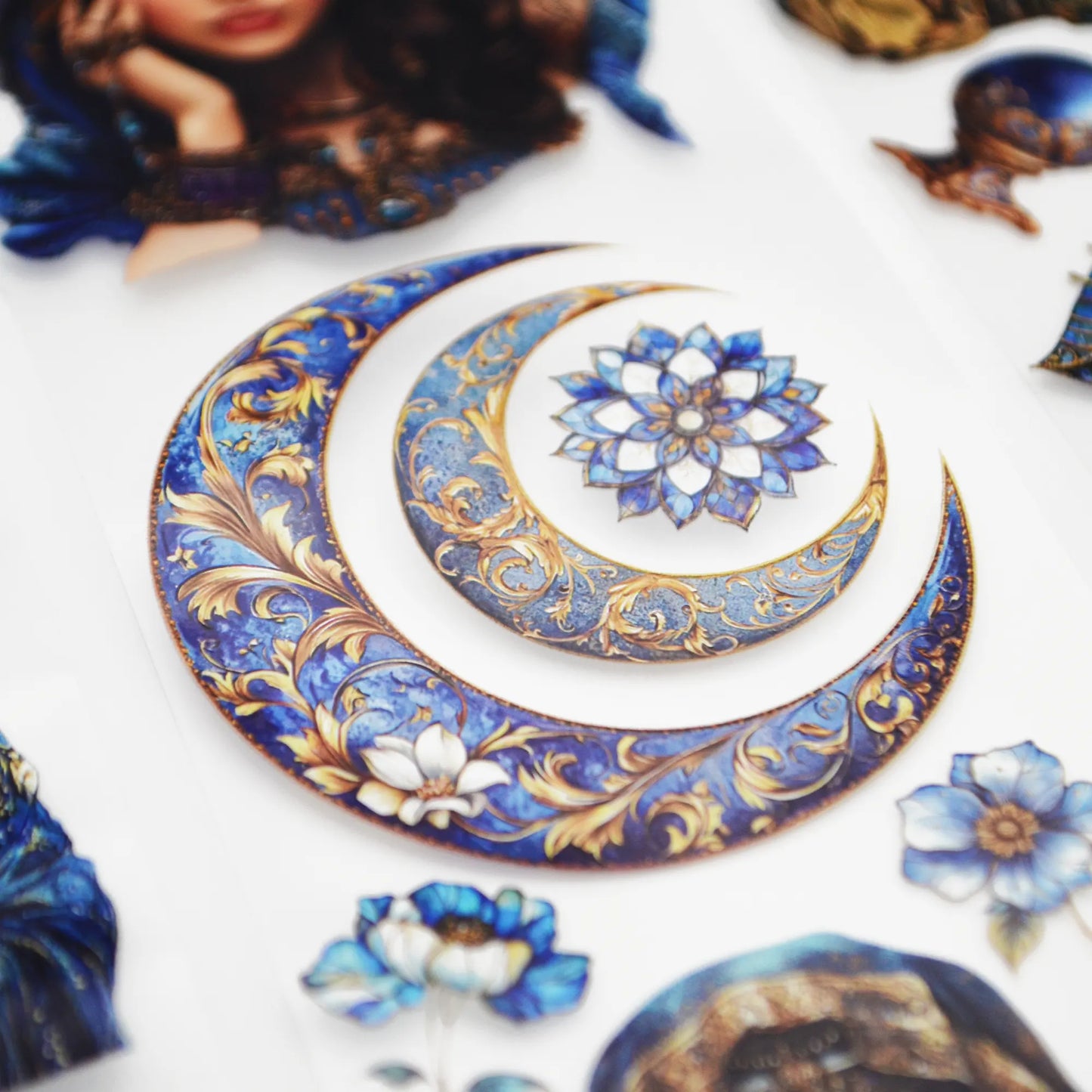 A roll of decorative PET tape stickers with a mystic fortune teller theme in blue and gold colours, featuring illustrations of the fortune teller, crystal balls, palmistry, decorative stained glass flowers, crystal geodes and more