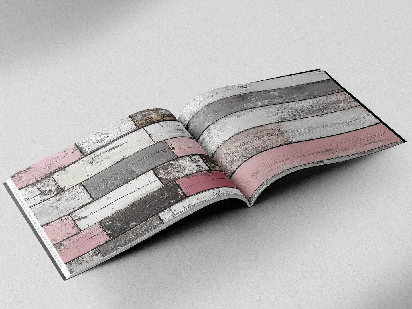 open book showing the inside pages of the decorative wooden textures prints pad. The picture inside the book is an pink and grey wooden boards texture