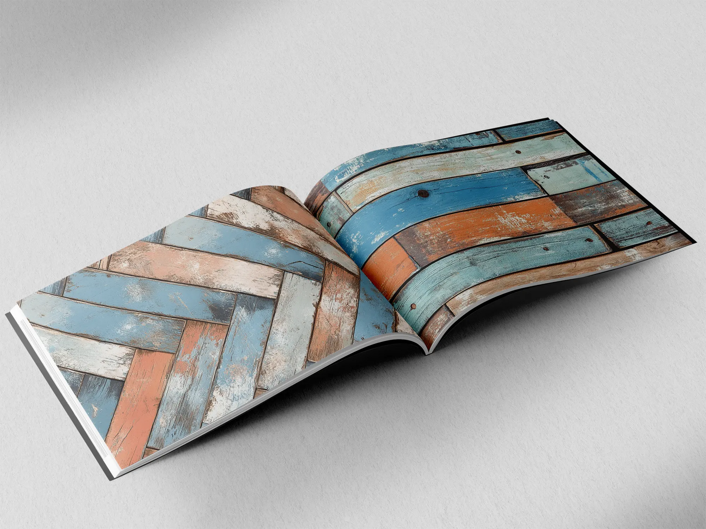 open book showing the inside pages of the decorative wooden textures prints pad. The picture inside the book is an light blue and orange wooden boards texture