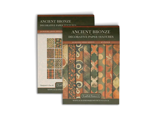 Front and back cover of a decorative paper prints pad with various patterns and textures in a orange and green colour, intended for use in junk journaling, scrapbooking, and cardmaking.