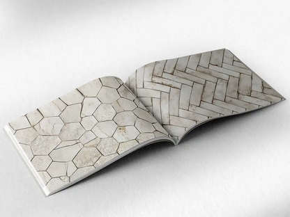 open book showing the inside pages of the decorative stone textures prints pad. The picture inside the book is a beige stone texture