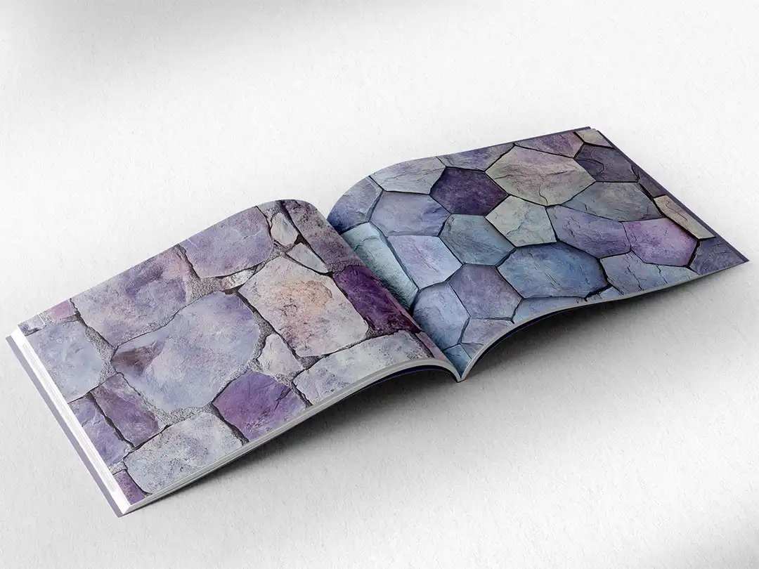 open book showing the inside pages of the decorative stone textures prints pad. The picture inside the book is a lilac stone texture