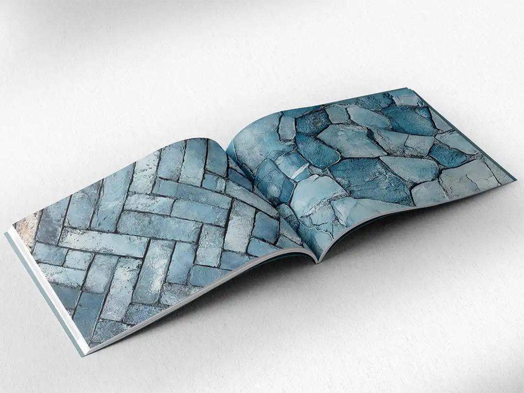 open book showing the inside pages of the decorative stone textures prints pad. The picture inside the book is a blue stone texture