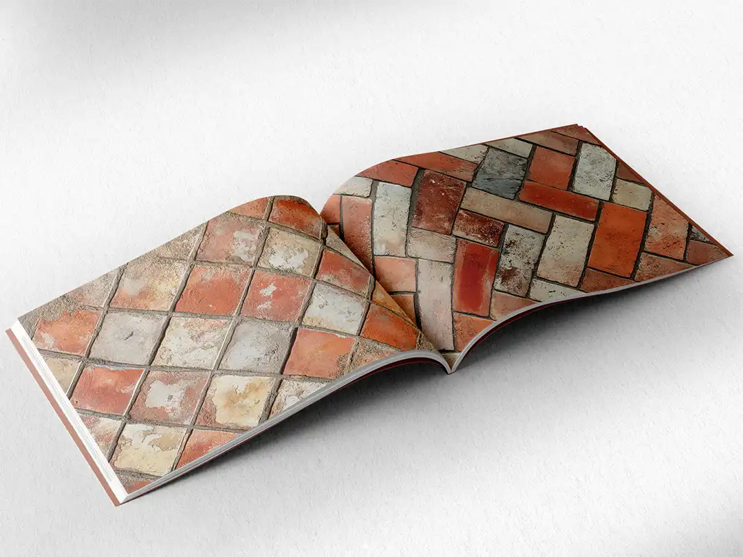 open book showing the inside pages of the decorative stone textures prints pad. The picture inside the book is a orange stone texture