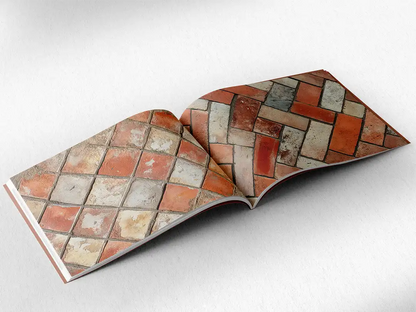 open book showing the inside pages of the decorative stone textures prints pad. The picture inside the book is a orange stone texture