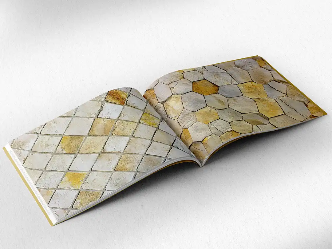 open book showing the inside pages of the decorative stone textures prints pad. The picture inside the book is a yellow stone texture