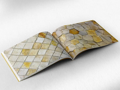 open book showing the inside pages of the decorative stone textures prints pad. The picture inside the book is a yellow stone texture